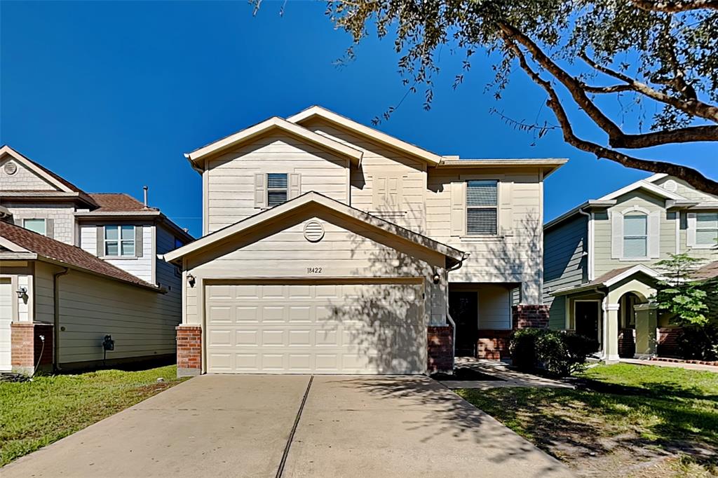 a front view of a house with a garage