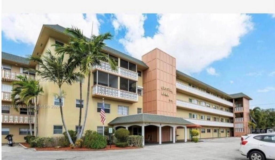 a front view of a building with street view