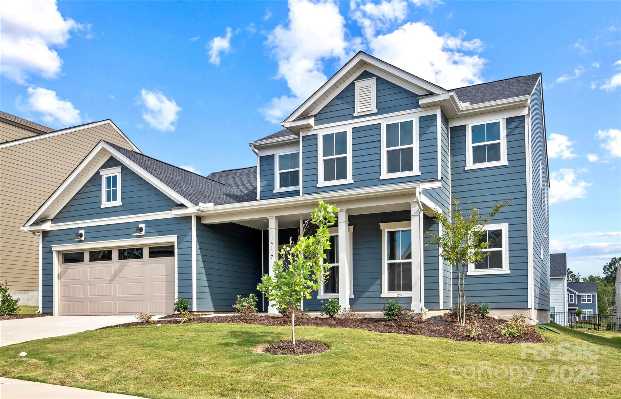 front view of a house with a yard