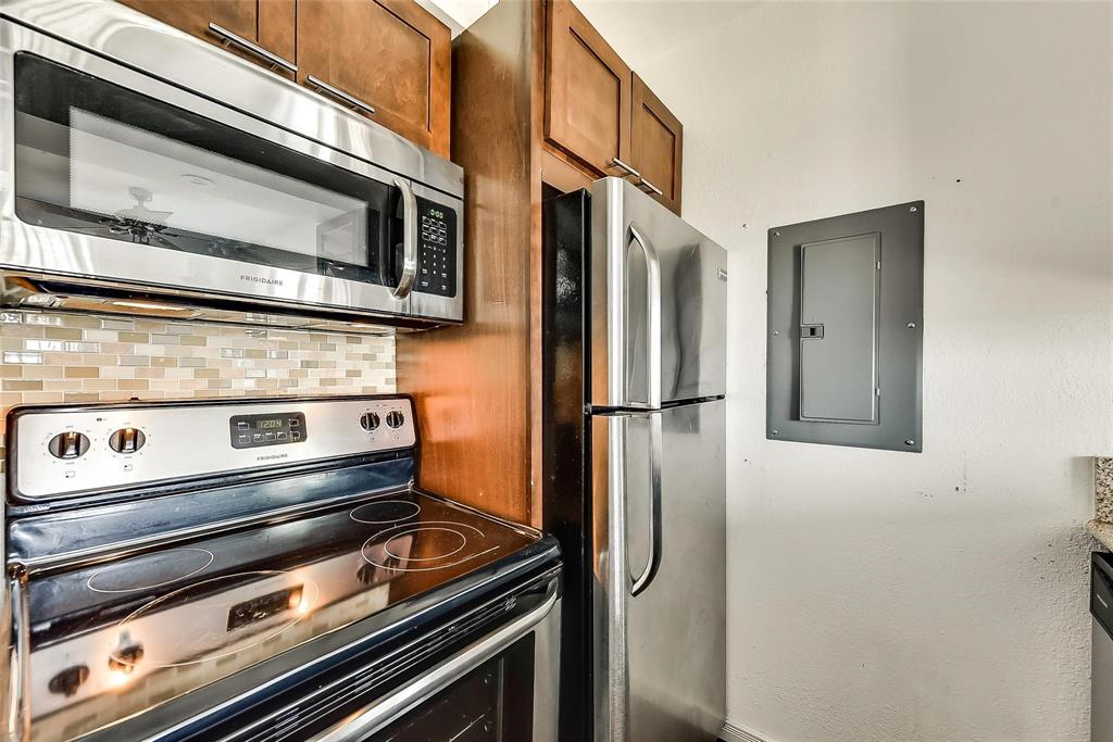 a stove top oven sitting inside of a kitchen