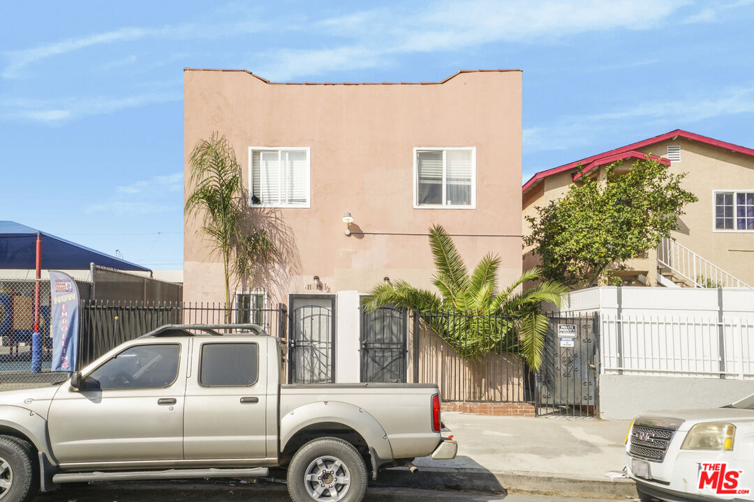 a view of a car park in front of a house