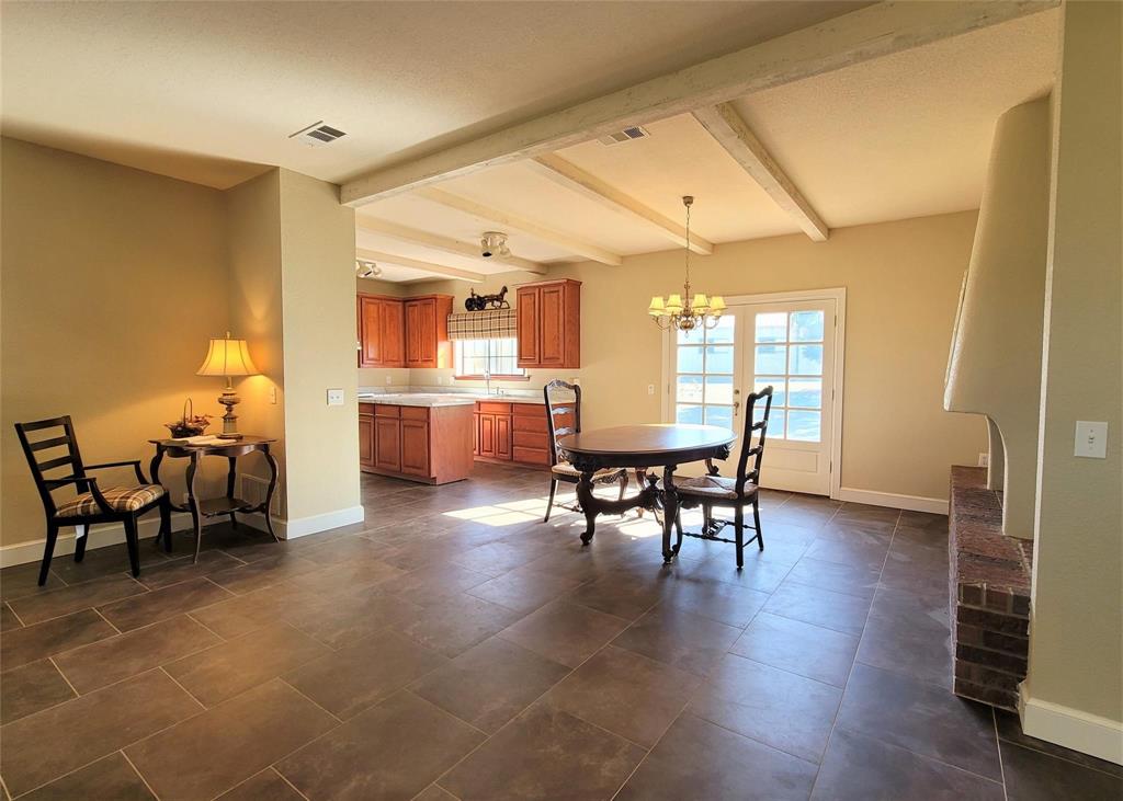 a view of a dining room with furniture and window