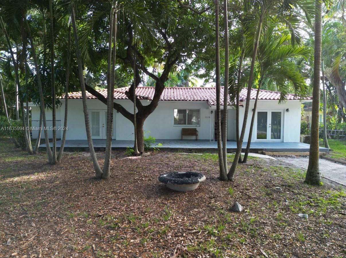 a view of a house and a yard