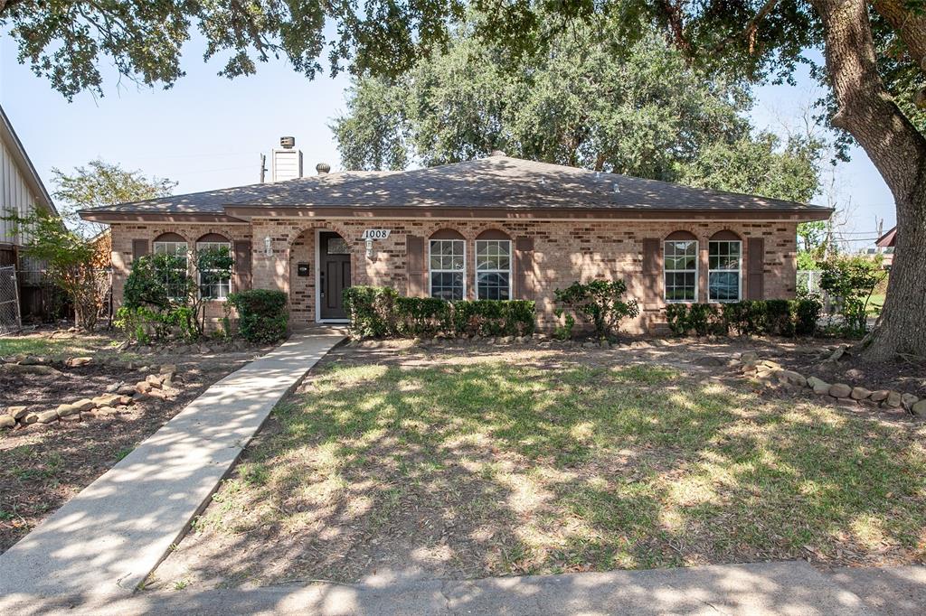 a front view of house with yard outdoor seating and barbeque oven