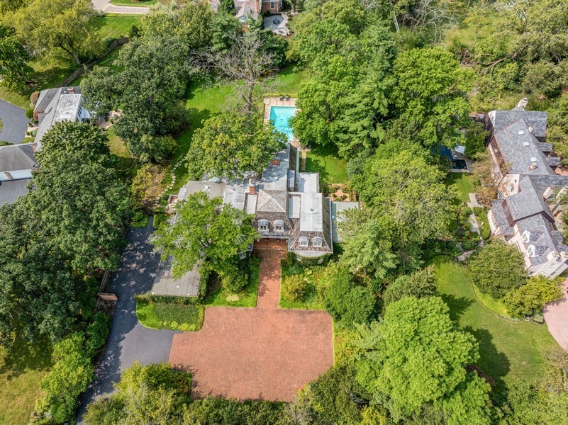 an aerial view of a house with a yard and garden