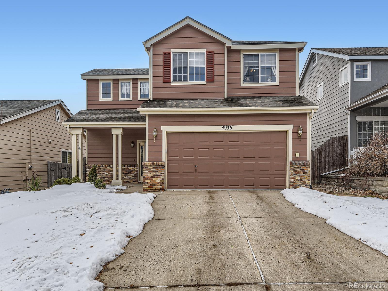 front view of a house with a small yard