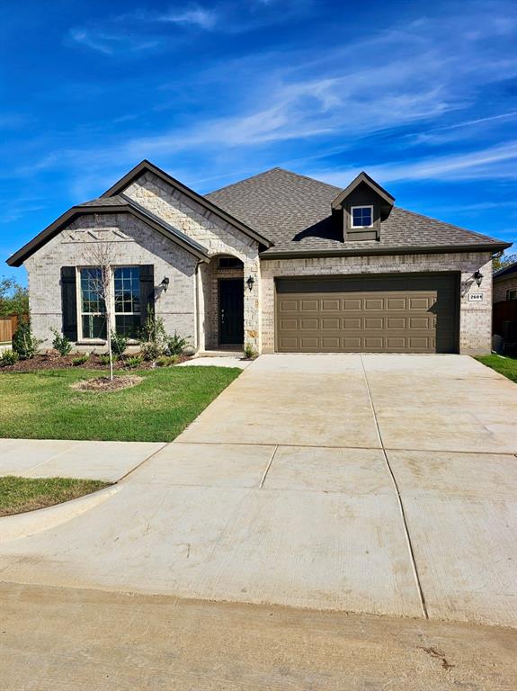 a front view of a house with yard