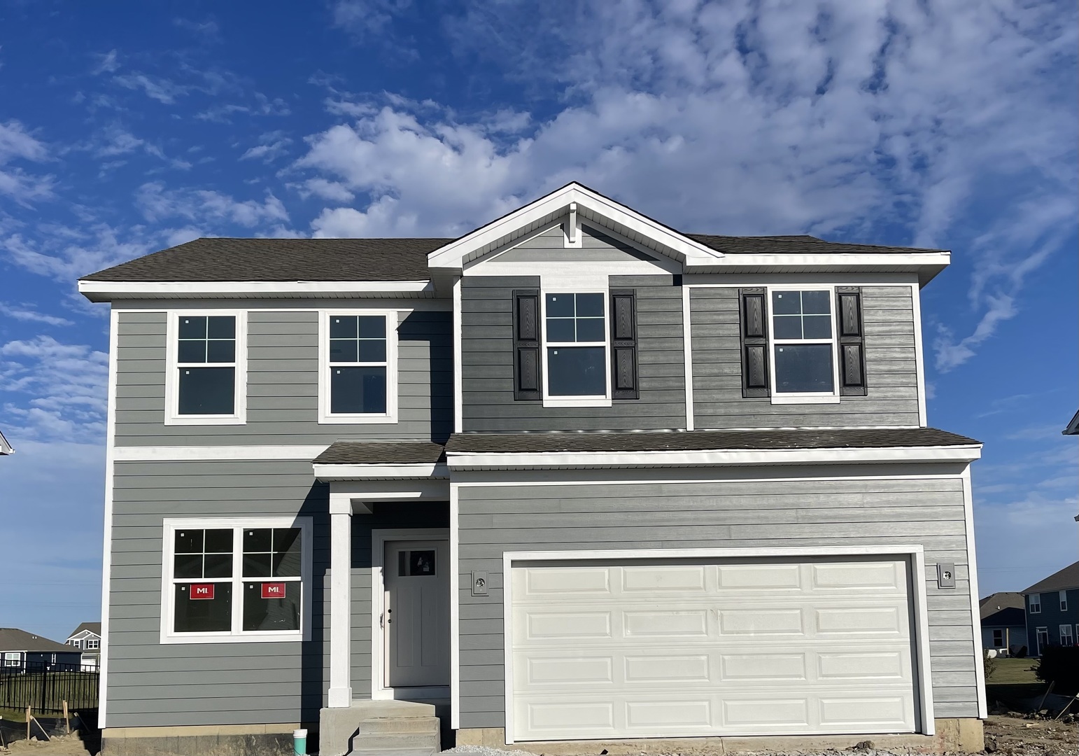 a front view of a house with garage