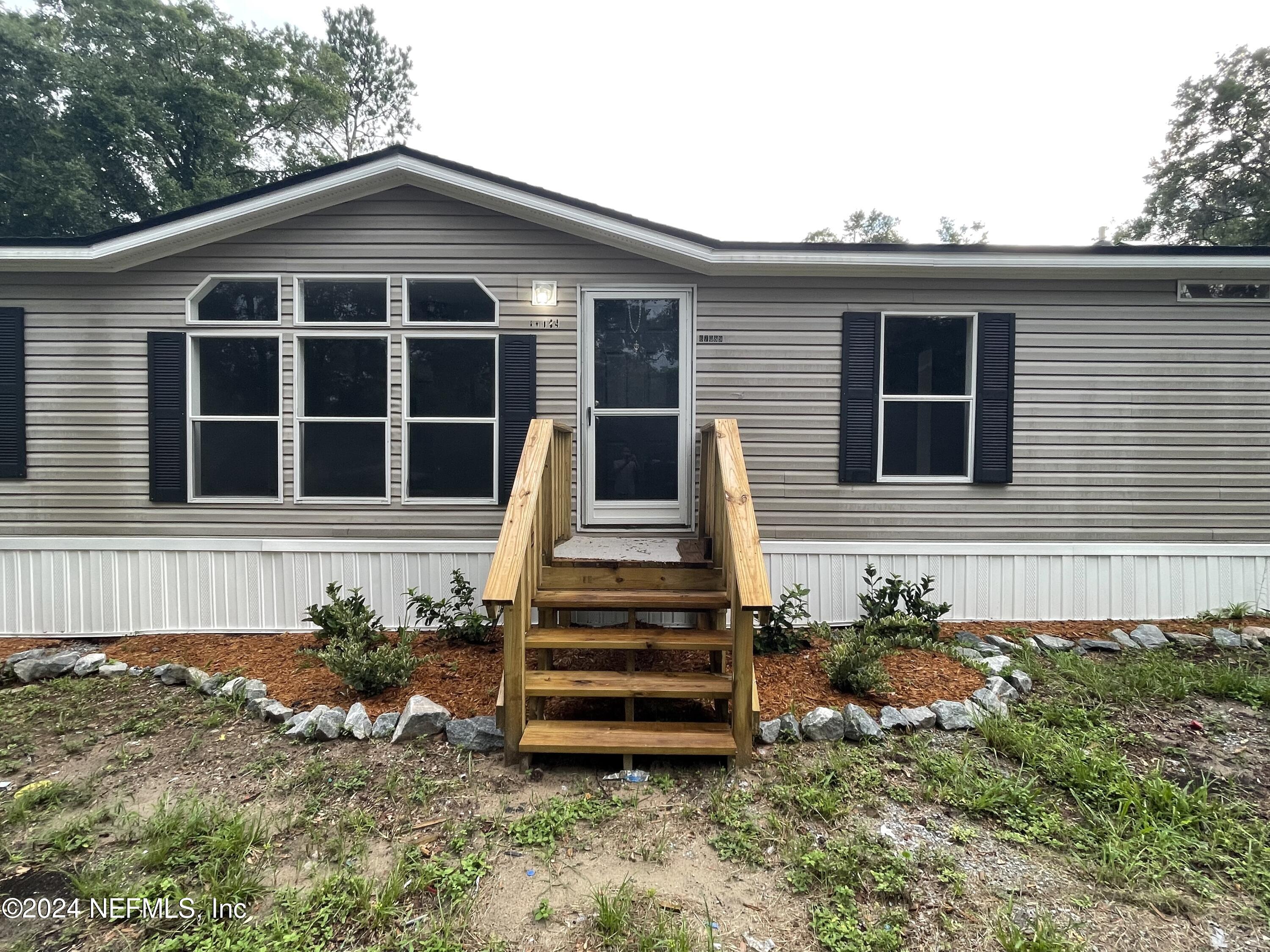 front view of a house with a yard