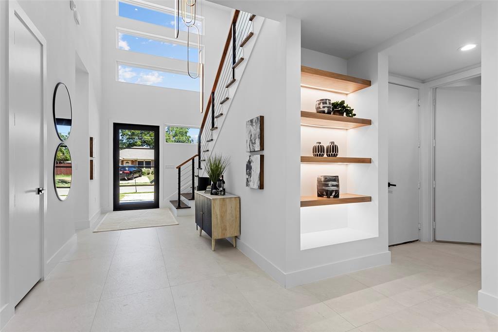 a view of an entryway and livingroom with furniture