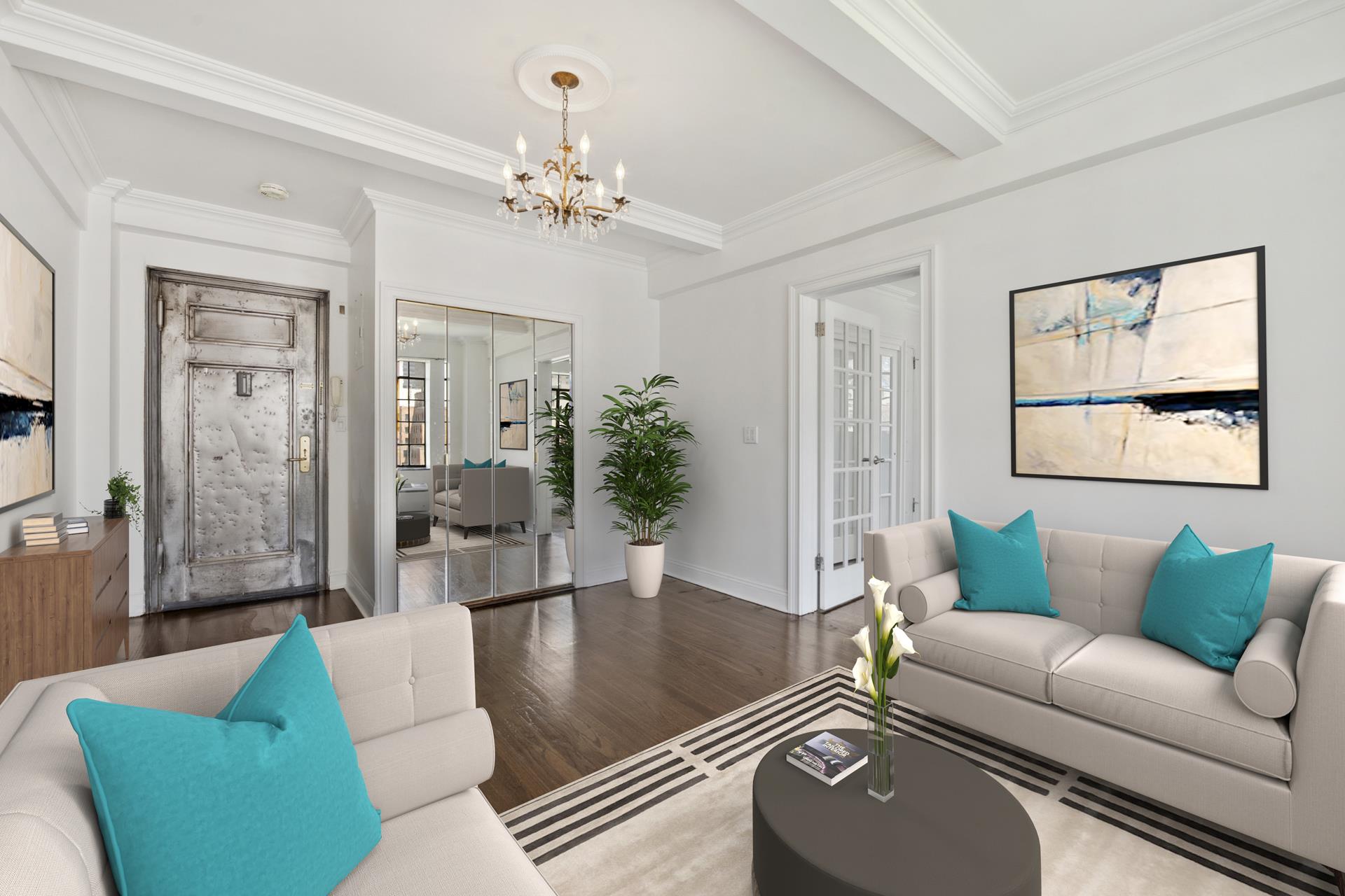 a living room with furniture and a chandelier