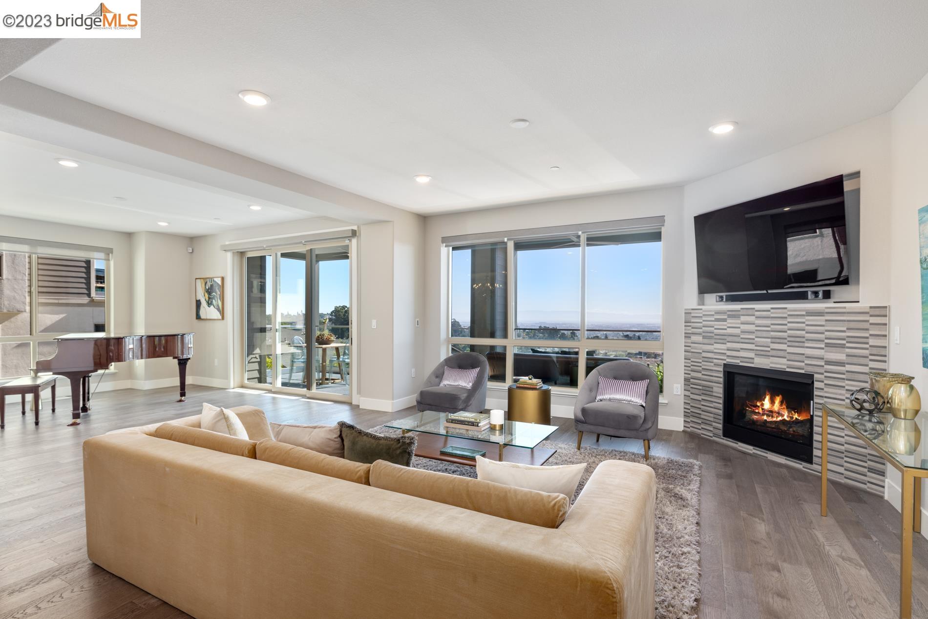 a living room with furniture fireplace and a flat screen tv