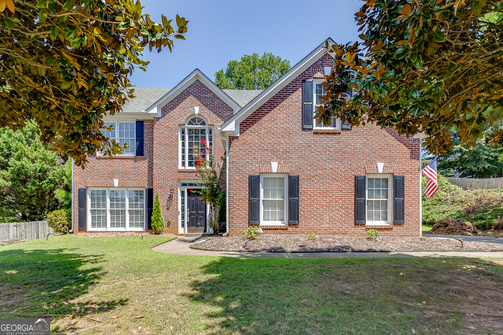 front view of a house with a yard