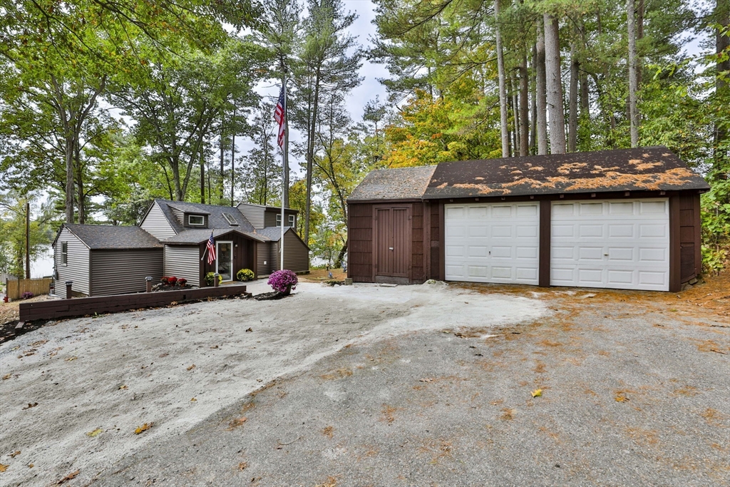 a view of a house with a yard and garage