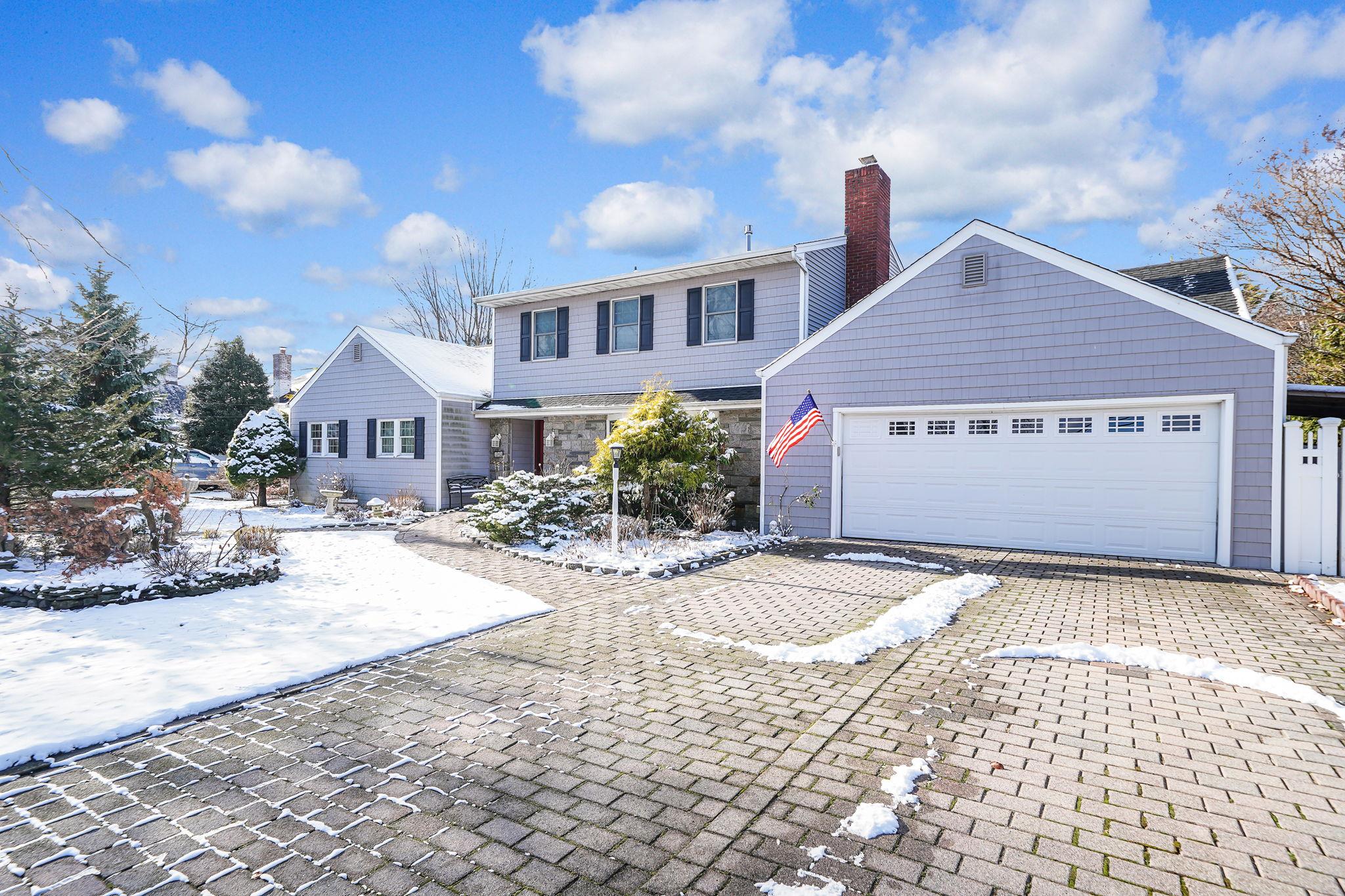 Front of property with a garage