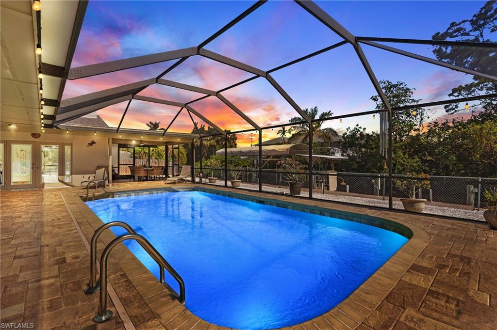 a view of a swimming pool with a lounge chair