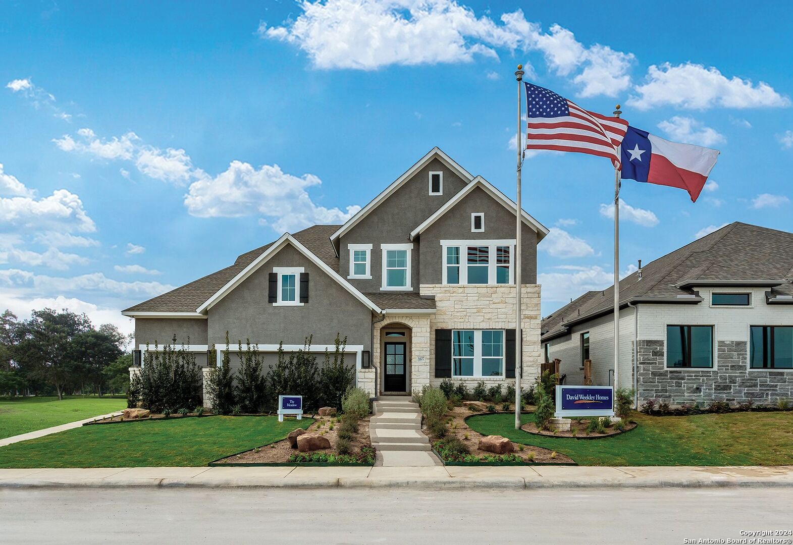 a front view of a house with a yard