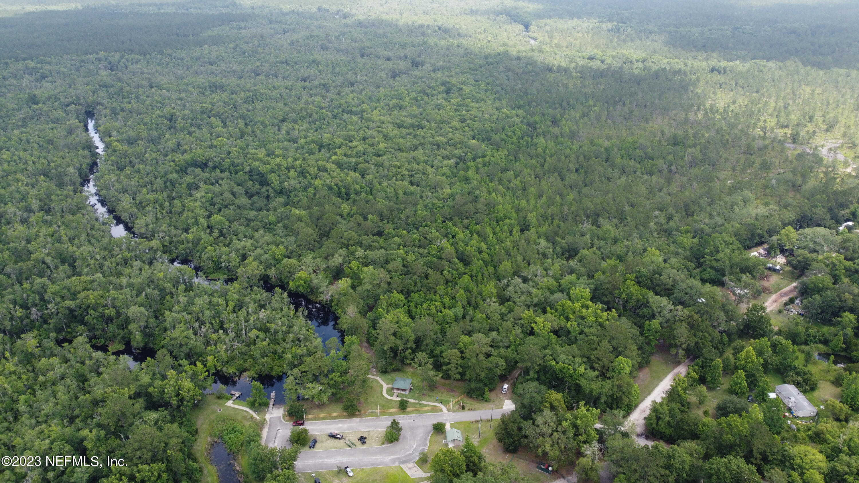 an aerial view of residential house with outdoor space