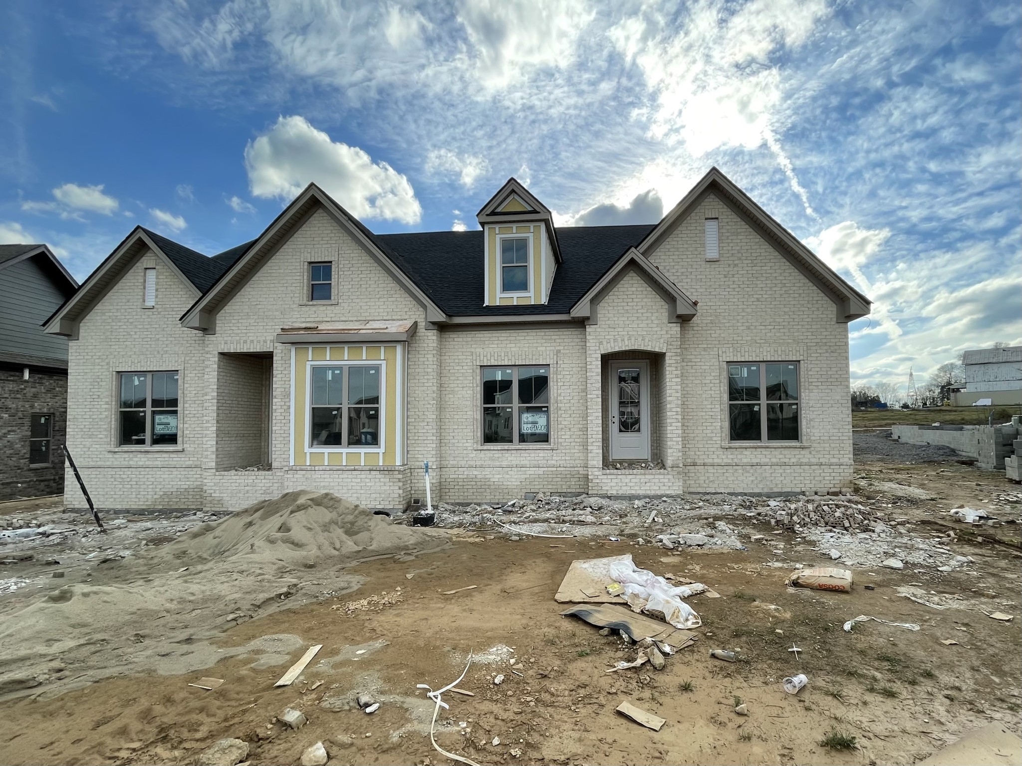 a front view of a house with a yard