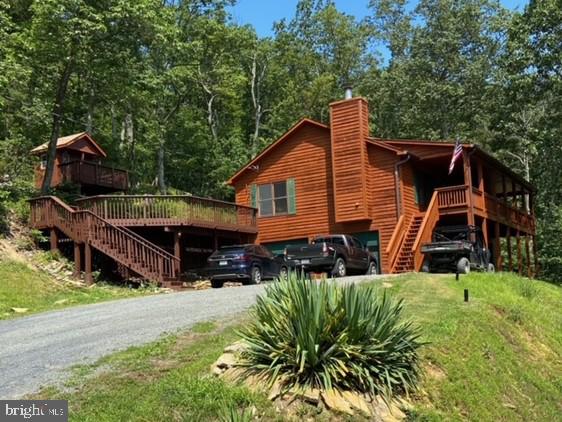 a view of house with a yard