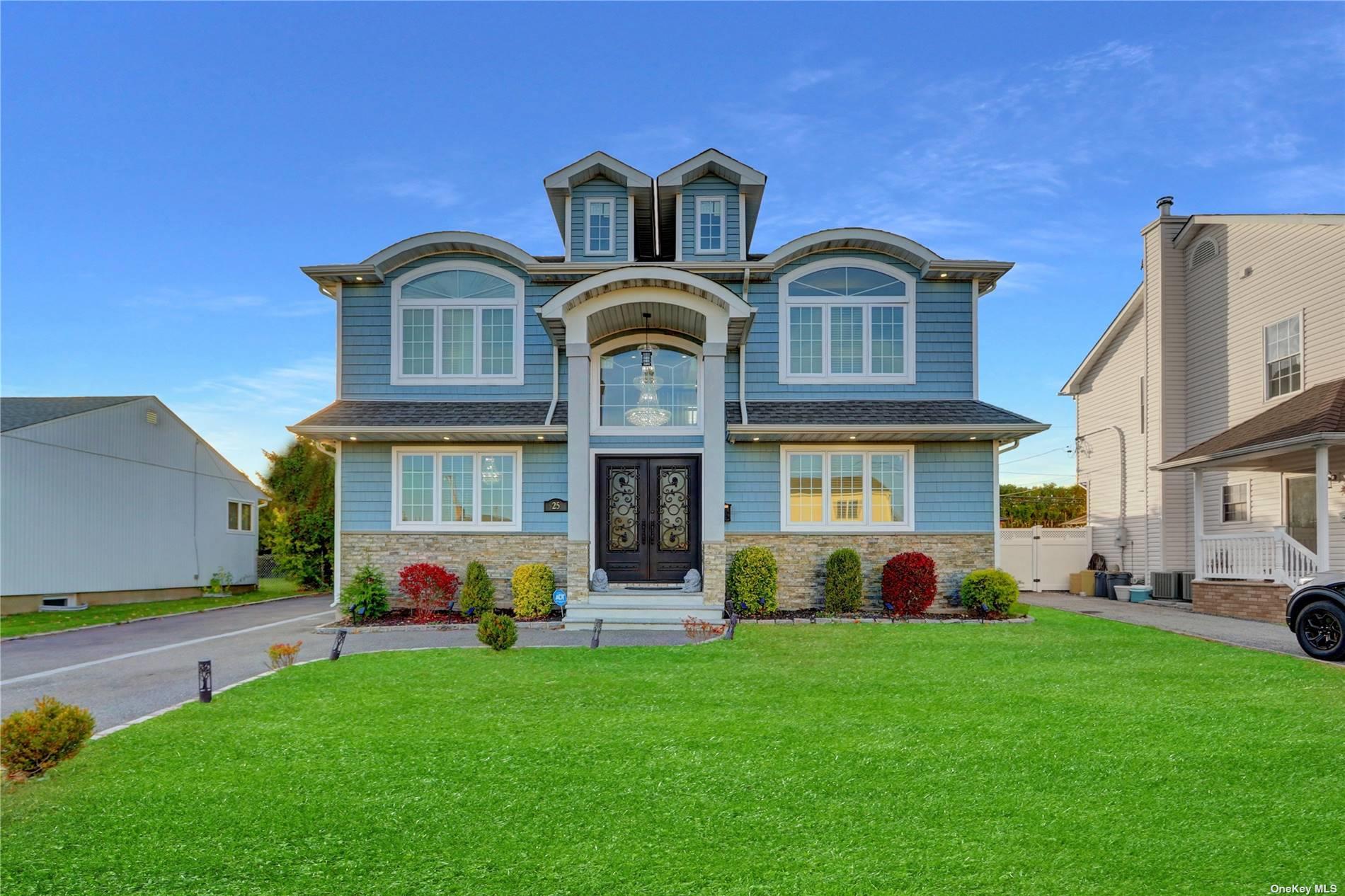 a front view of a house with a garden