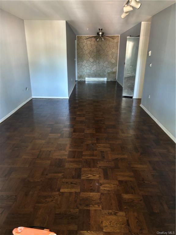 a view of a hallway with hardwood floor