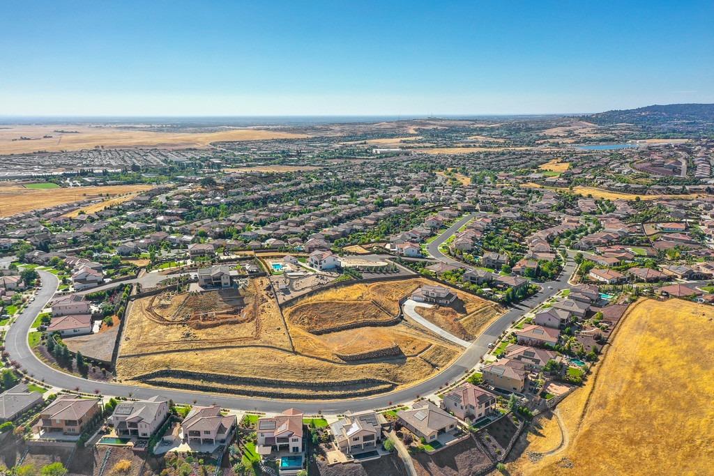 an aerial view of residential building and ocean view