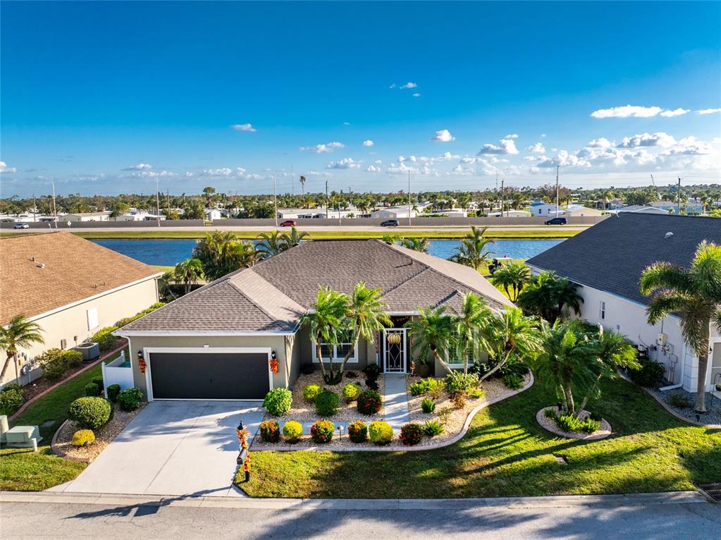 an aerial view of a house with swimming pool yard and outdoor seating