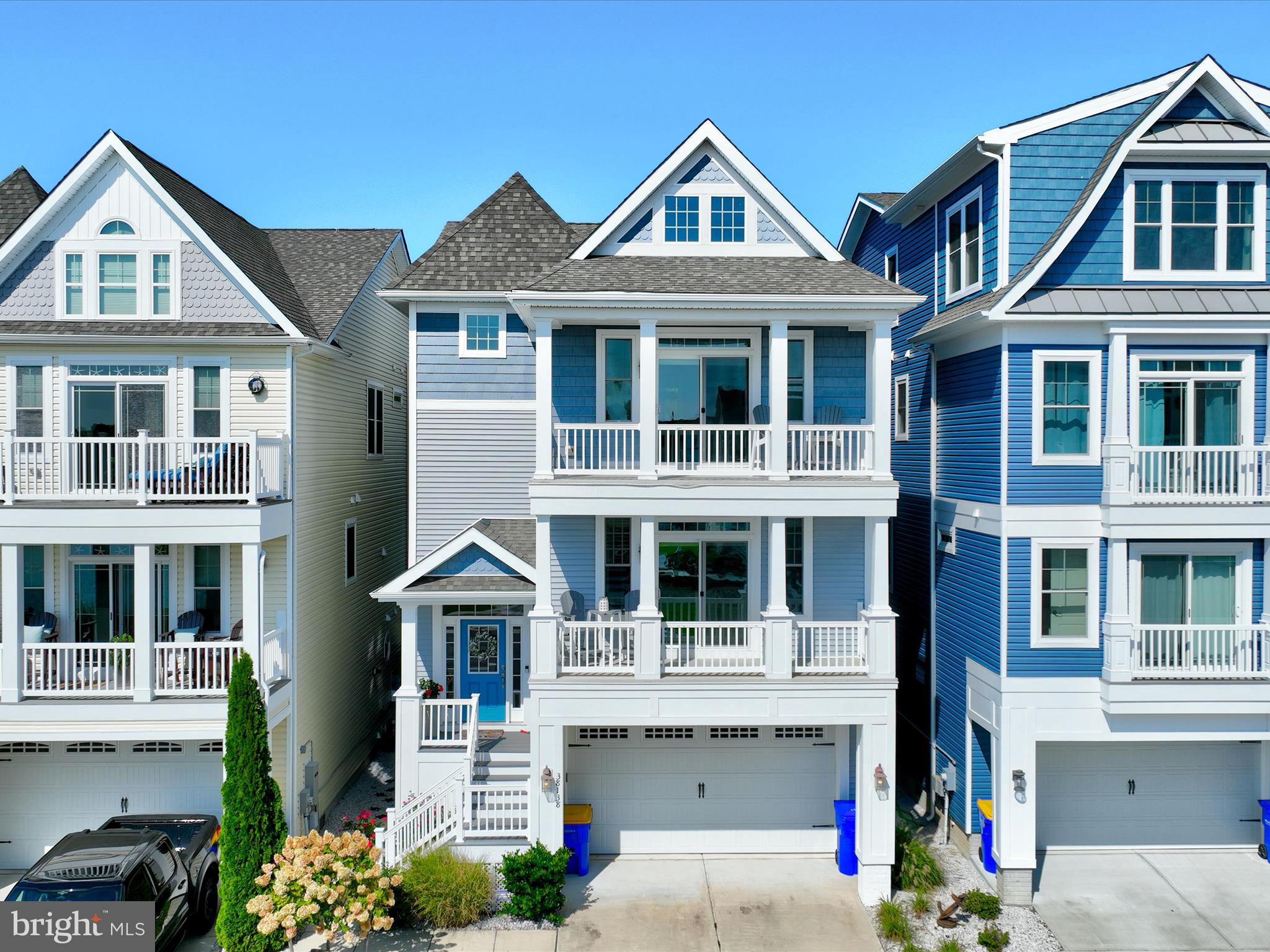 a front view of a residential apartment building with a yard