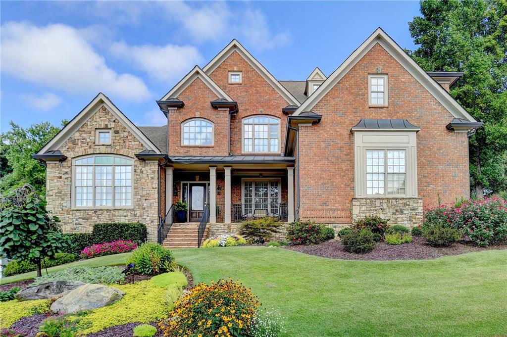 a front view of a house with garden