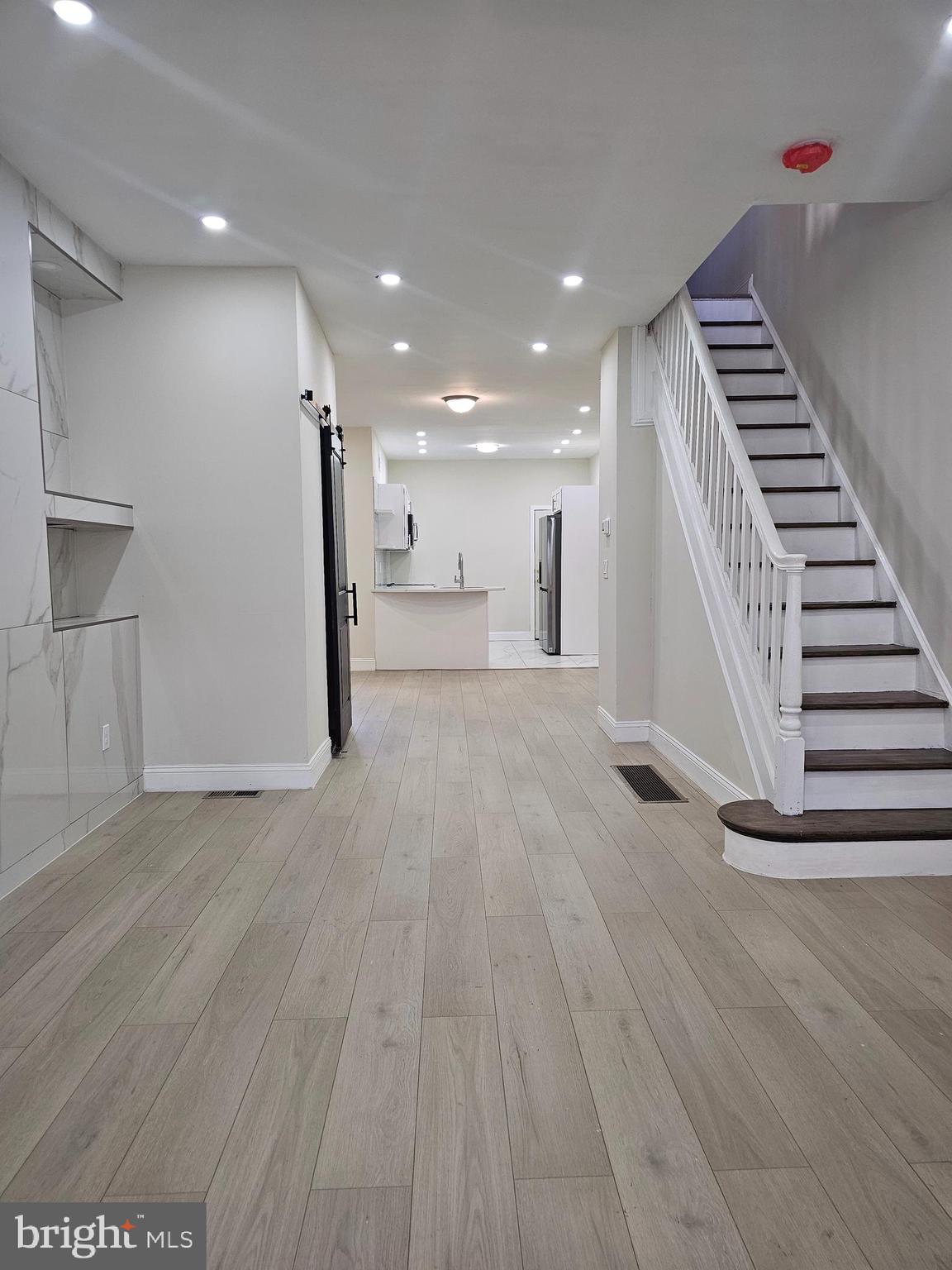 a view of outdoor space with wooden floor and stairs