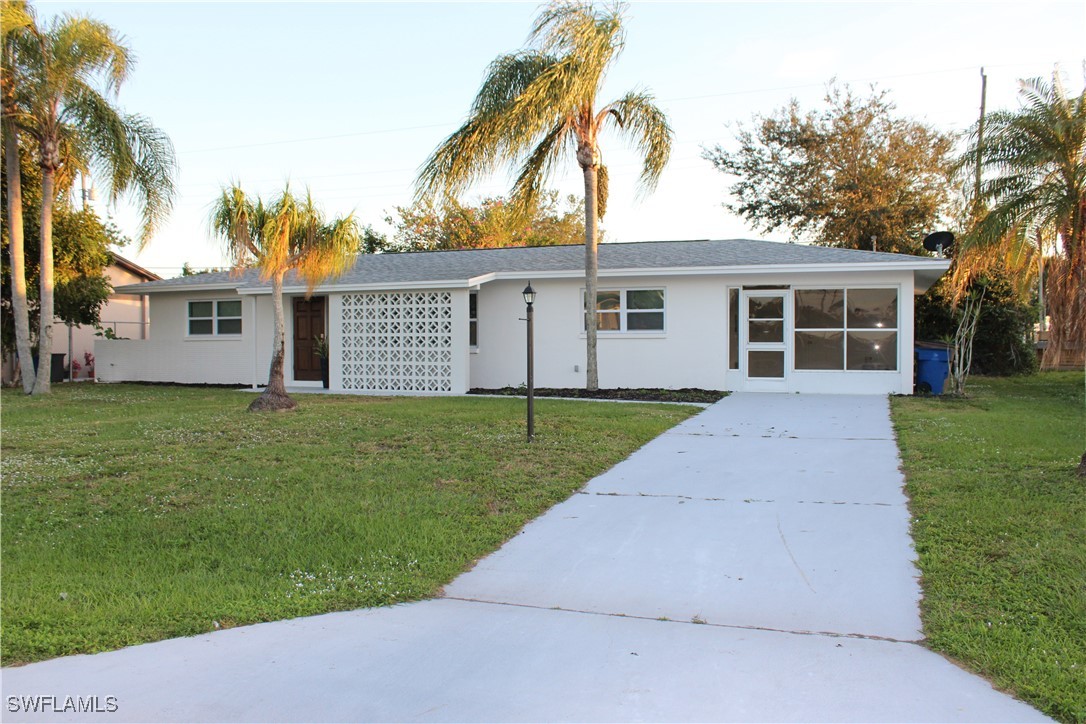 front view of a house and a yard