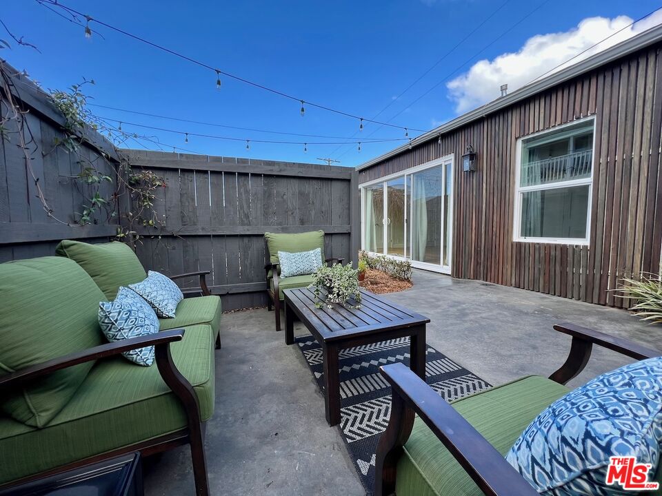 a backyard of a house with seating space