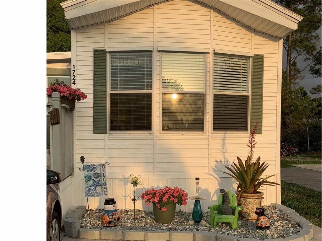 a view of a house with a potted plant