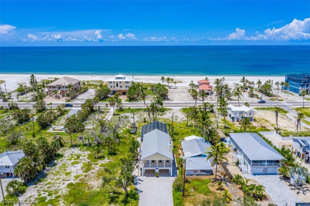 an aerial view of a house with a ocean view