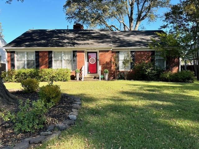 Single story home featuring a front yard