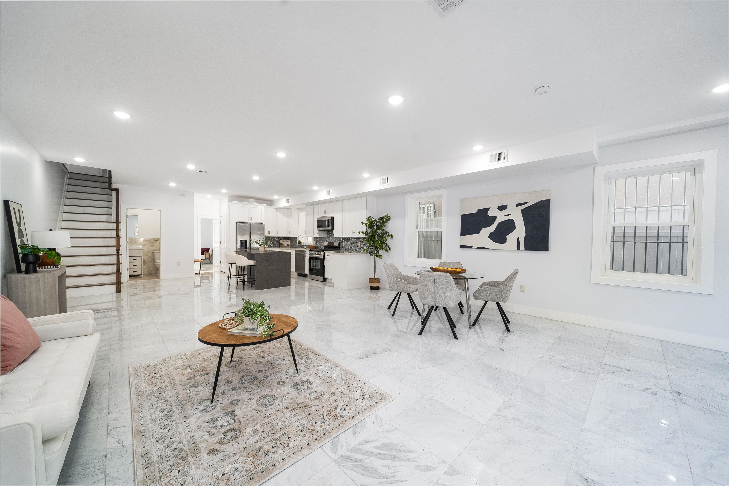 a living room with furniture and a table