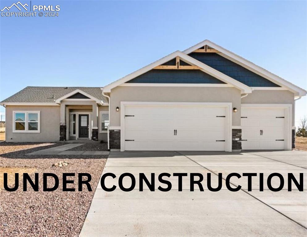 a front view of a house with a garage