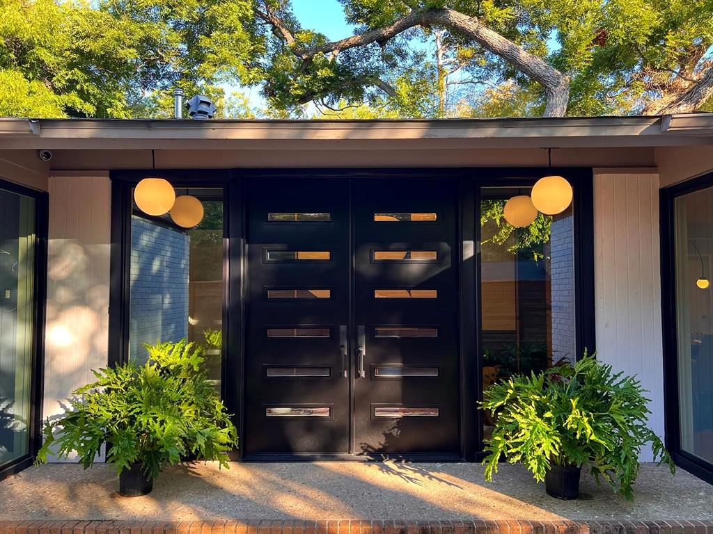 a view of a house with a flower garden