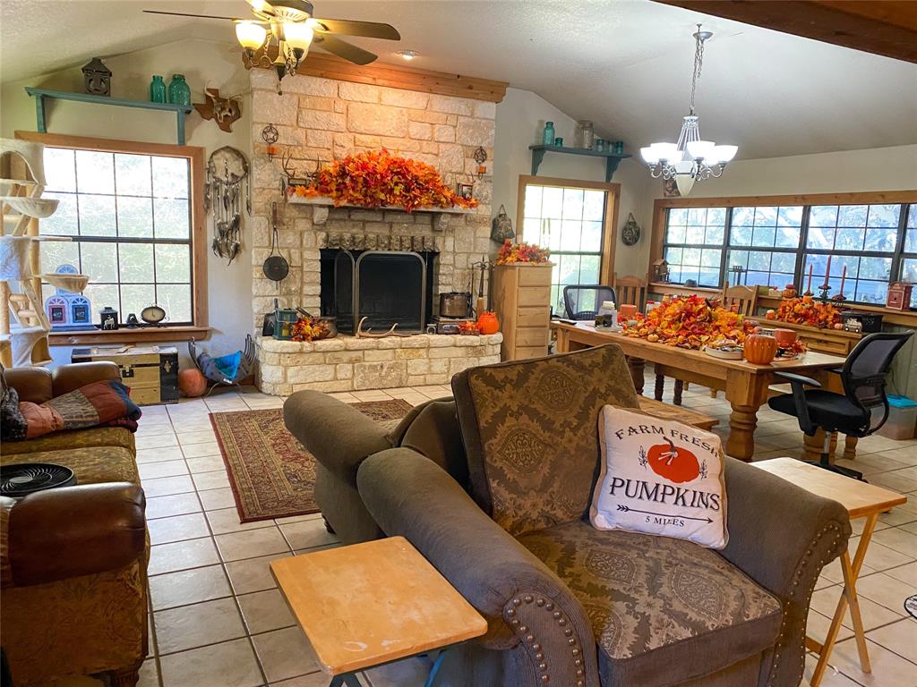 a outdoor living space with furniture and a fireplace