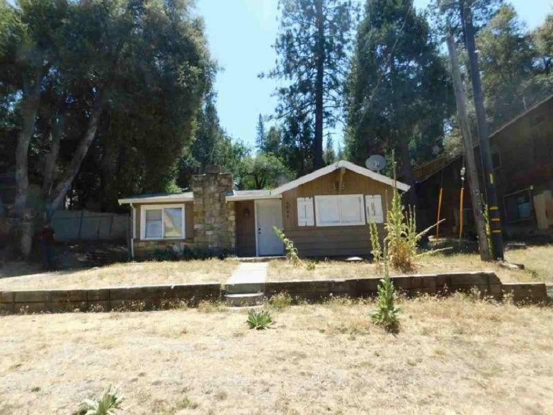 a house with trees in the background