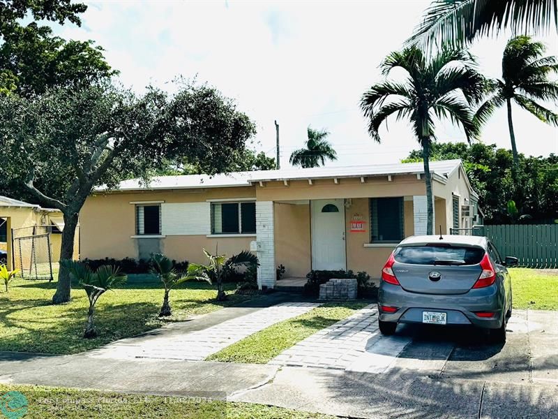 a view of a car in front of a house