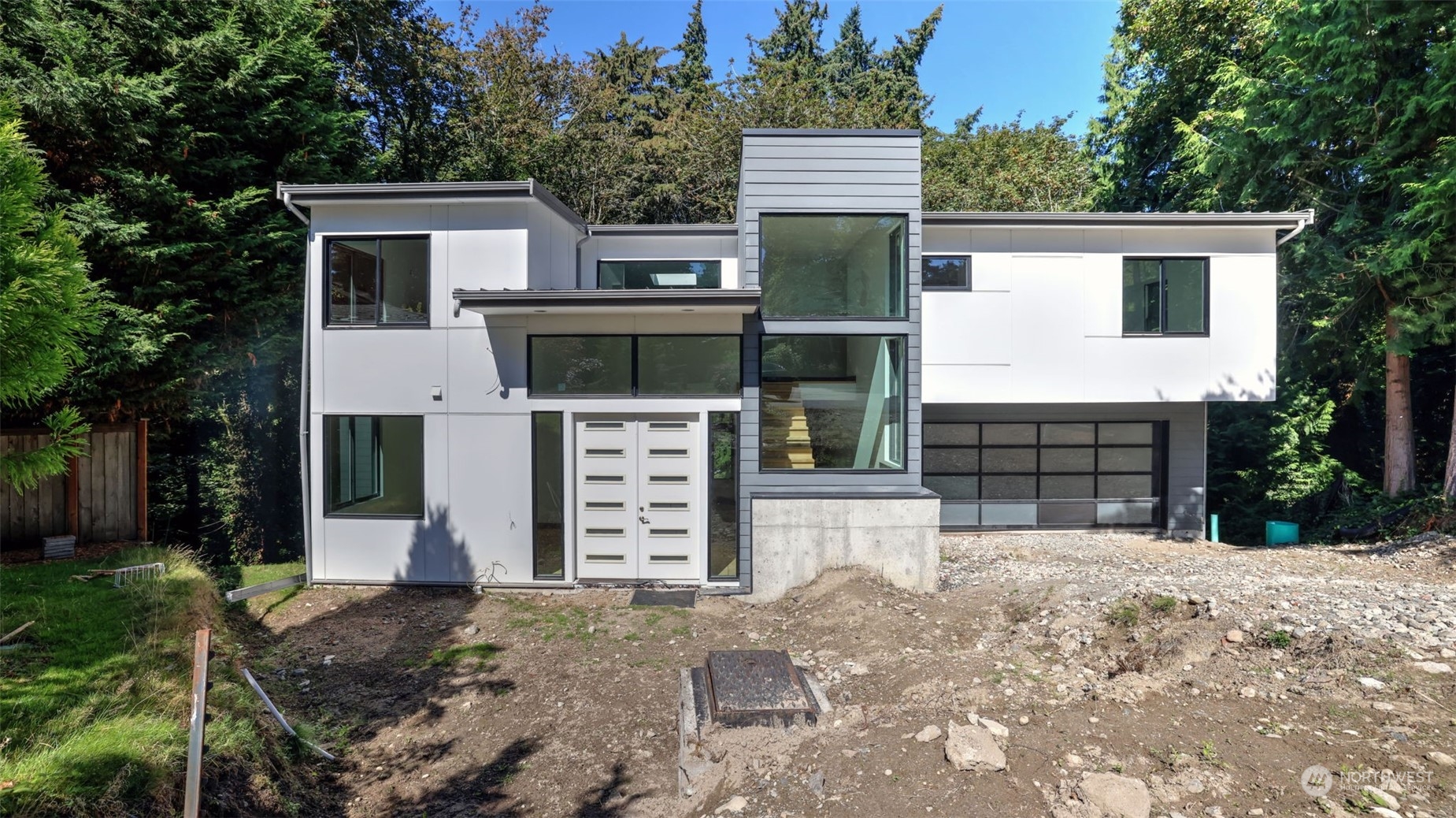 a view of a house with a yard and garage