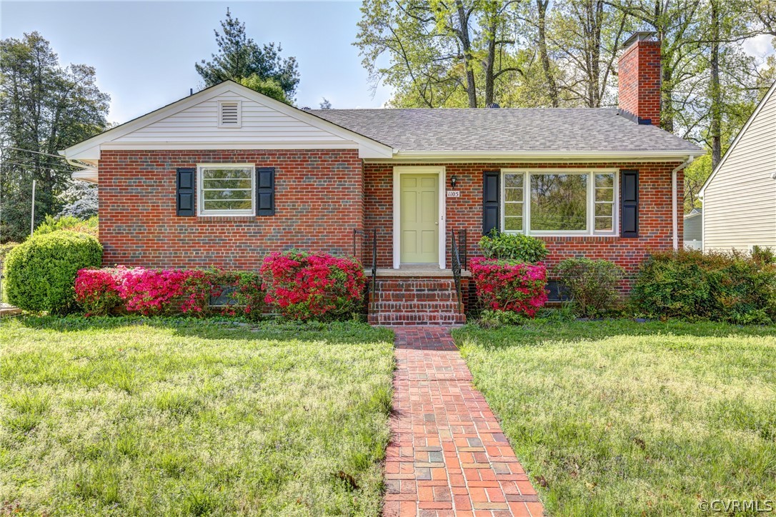 a front view of a house with yard