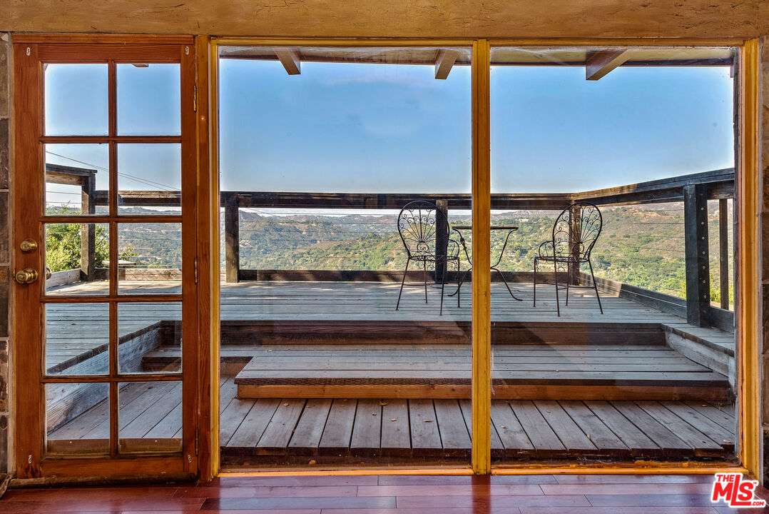 a view of living room with wooden floor