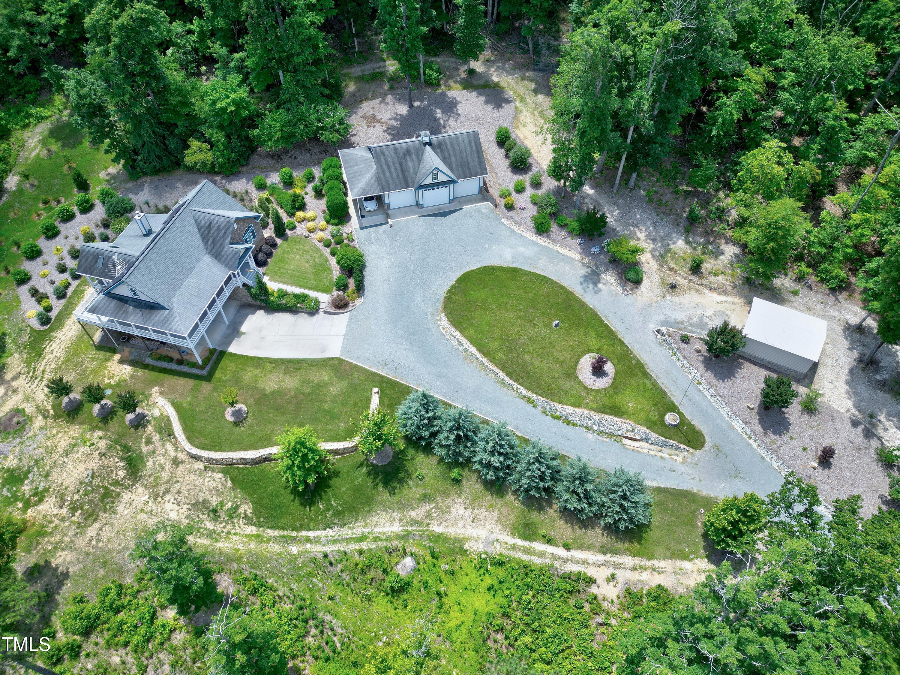 an aerial view of a house with a yard