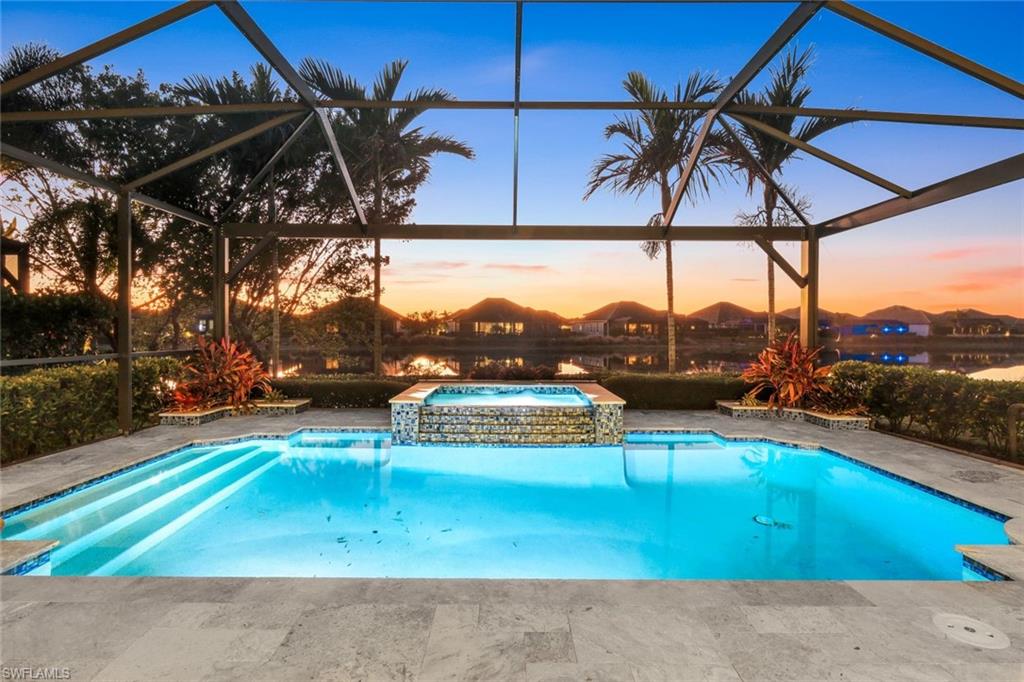 a view of a swimming pool with a patio and a yard