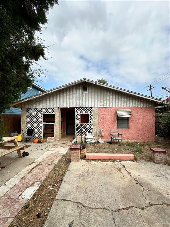 a house with pool table and chairs