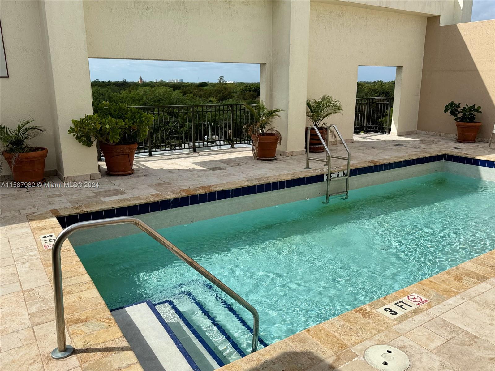 a view of swimming pool from a lounge chair