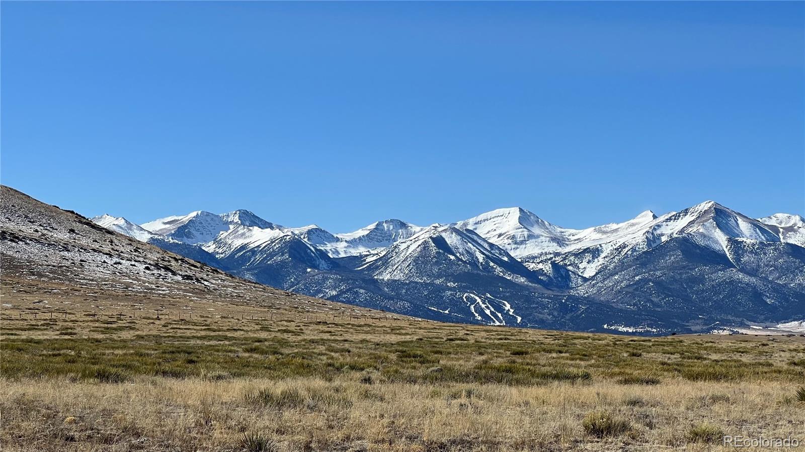 a view of a large body of water with a mountain in the background